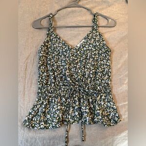 pretty green tank top with pastel white, yellow, and blue flowers